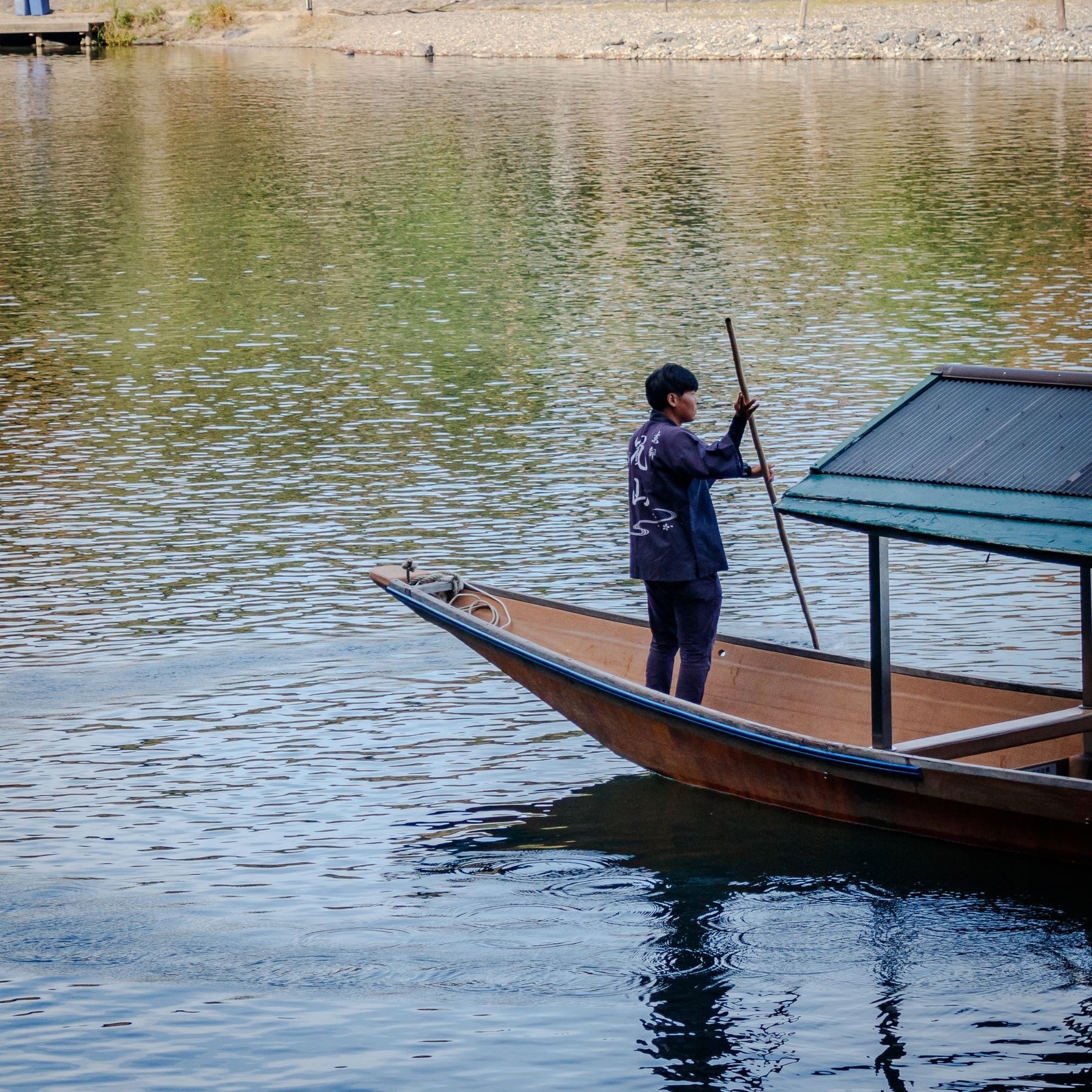 Boatman on Arashiyama river